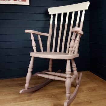 Two-tone pink and white painted wooden rocking chair