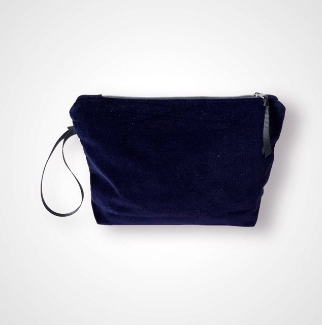 Luxury navy velvet makeup bag with blue peacock feathers print with golden shimmer