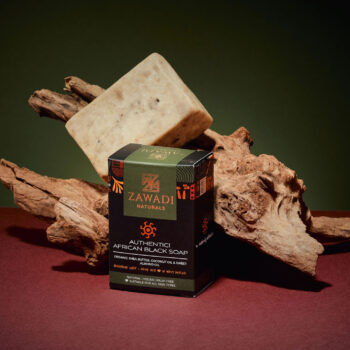 Authentic African black soap bar made with raw shea butter, showing natural texture and earthy color
