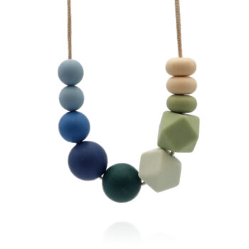 Green, blue and cream-coloured necklace inspired by the Isesjø lake in Norway, on white background