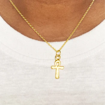 Gold Ankh Pendant worn on model with white top