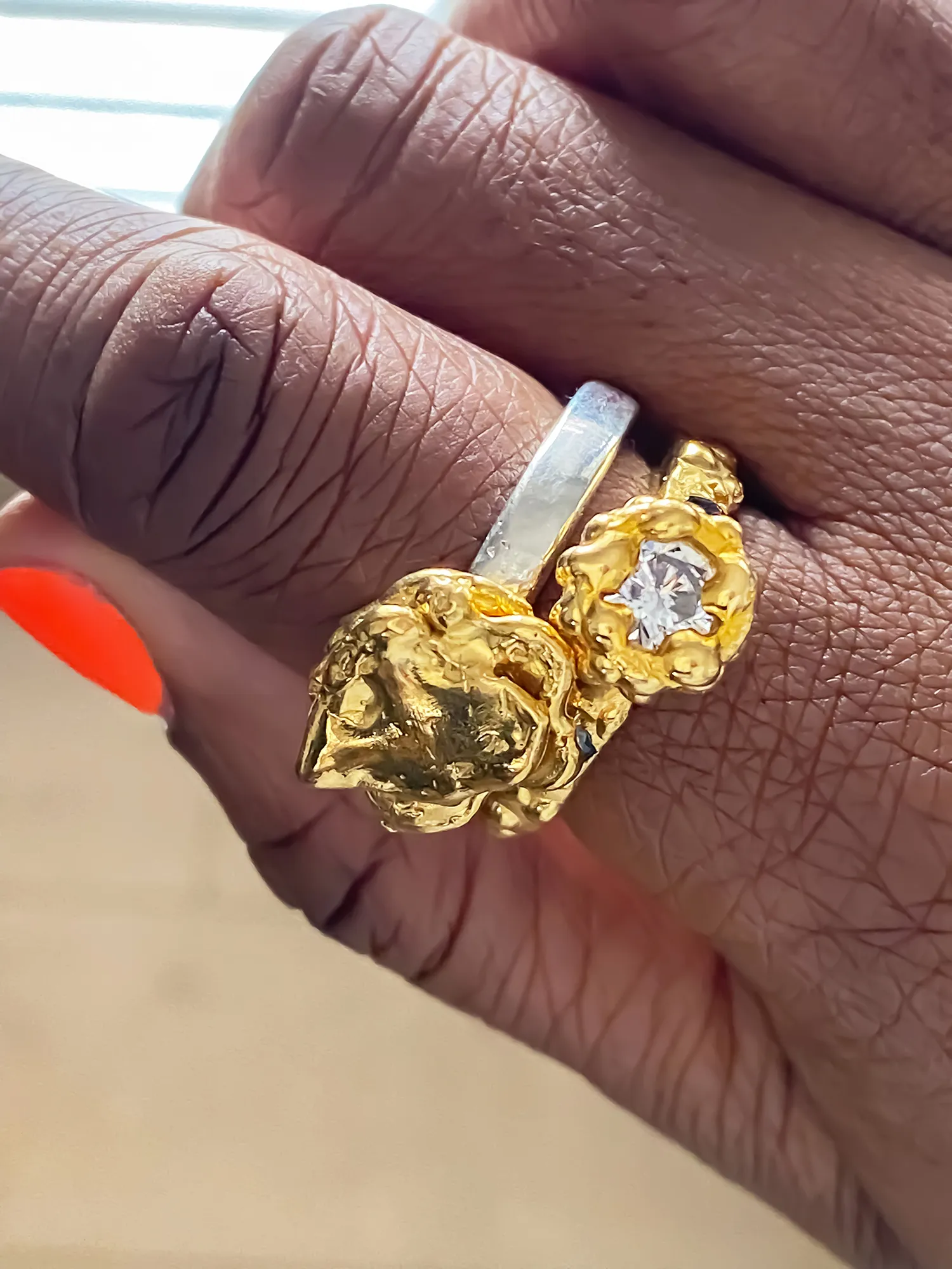 Orbit Ring in gold vermeil worn on hand with gemstone detail