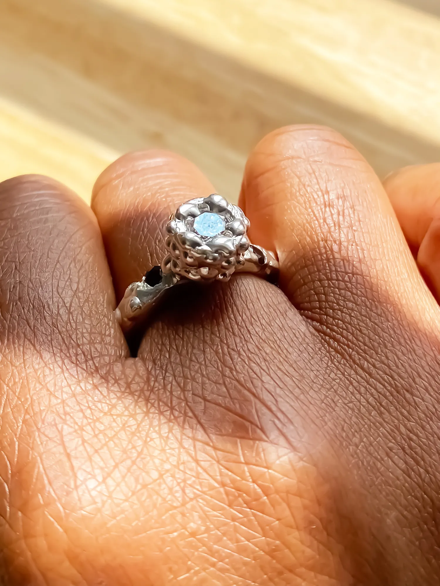 Silver Orbit Ring worn on hand in natural light