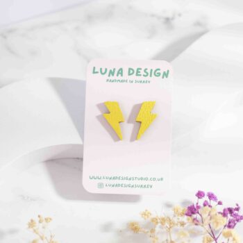 Small lightning bolt-shaped stud earrings made from yellow leather